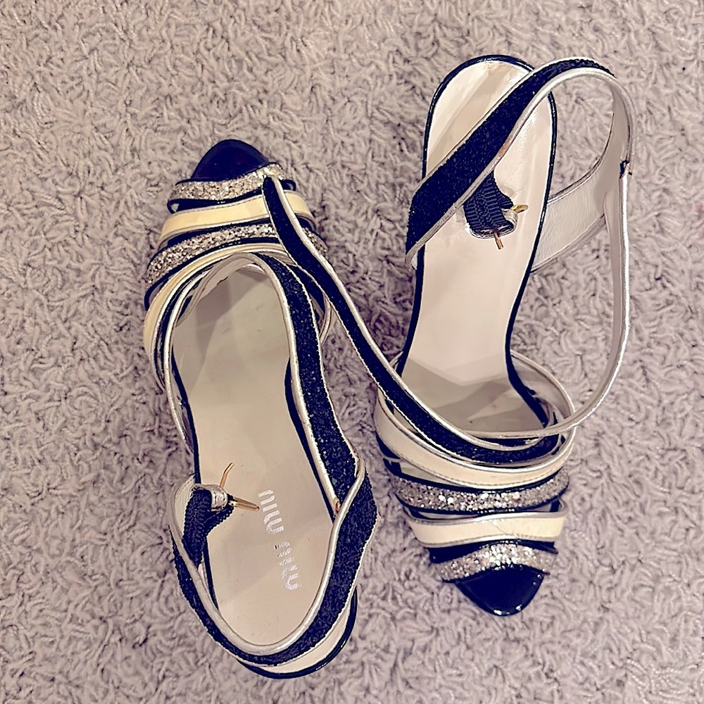 Miu Miu black, cream and gold heeled sandals.